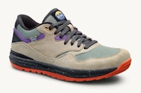 a men's grey and purple shoe with orange soles