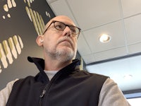 a man wearing a black vest